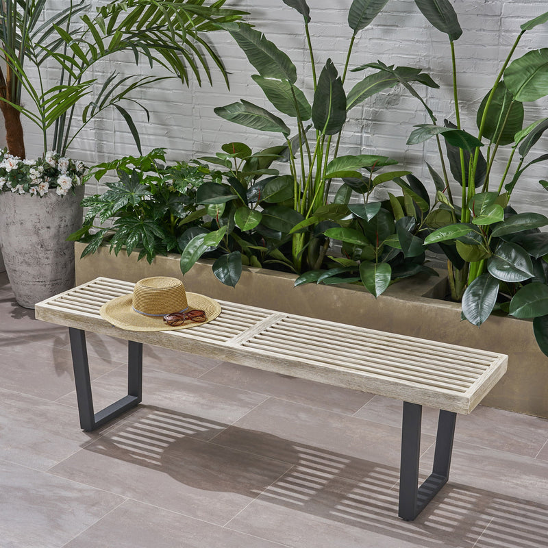 Noble House Intrinsic outdoor dining bench with slat top, sturdy wooden bench suitable for garden or patio seating.