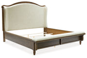 Benchcraft Sturlayne 6-piece panel bedroom set with bed frame, dresser, mirror, and nightstands in a modern bedroom setting.