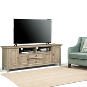 Simpli-Home Amherst wide TV media stand with open shelves and storage compartments for entertainment equipment.