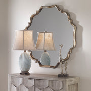 Uttermost Valentia silver wall mirror with a sleek, modern frame, reflecting light and adding elegance to contemporary interiors.