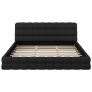 Upholstered platform bed with headboard in neutral fabric, featuring clean lines and a modern design by Dreamland.