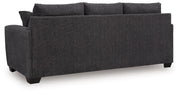 Benchcraft Loreo sofa sleeper with plush fabric, modern design, and convertible seating shown in a stylish living room setting.