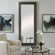 Gray Figaro oversized accent mirror by Uttermost with a modern, rounded rectangular frame hanging on a wall.