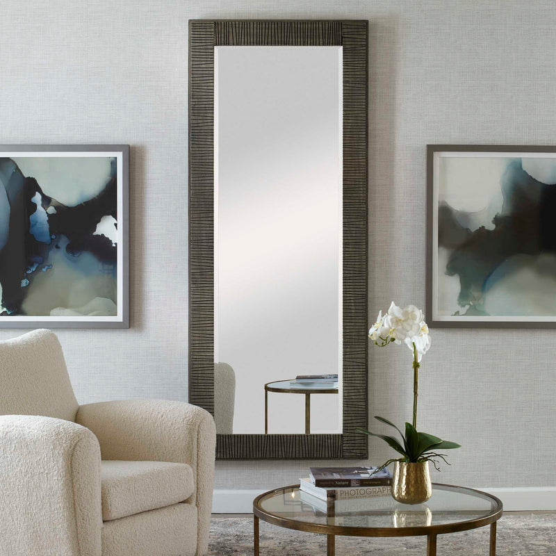 Gray Figaro oversized accent mirror by Uttermost with a modern, rounded rectangular frame hanging on a wall.