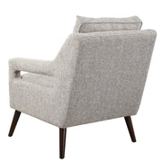 Uttermost O'Brien armchair with plush fabric upholstery and sleek wooden legs, showcasing a modern and comfortable design.