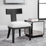 Uttermost Idris armless side chair with upholstered seat and wooden legs, modern design and neutral fabric.