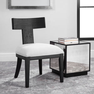 Uttermost Idris armless side chair with upholstered seat and wooden legs, modern design and neutral fabric.