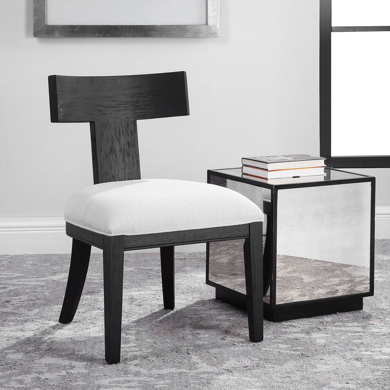 Uttermost Idris armless side chair with upholstered seat and wooden legs, modern design and neutral fabric.