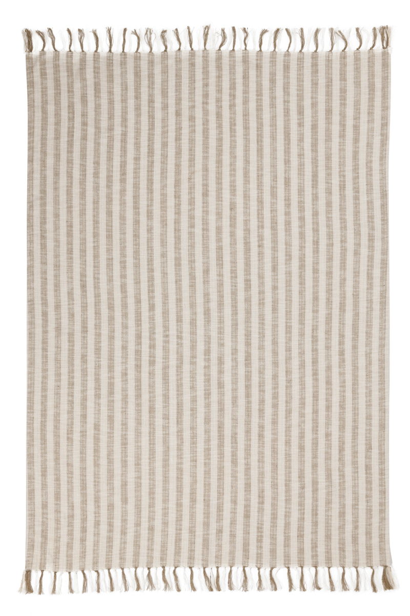 Classic Home Linna 50x70 inch ivory and natural throw blanket draped over a sofa, showcasing soft, cozy fabric and elegant design.