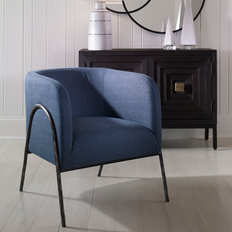 Uttermost Jacobsen accent chair with plush beige upholstery and sleek wooden legs, stylishly designed for modern living spaces.