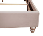 Transitional upholstered bed by Glory Furniture with plush fabric and modern design, shown in a well-lit bedroom setting.