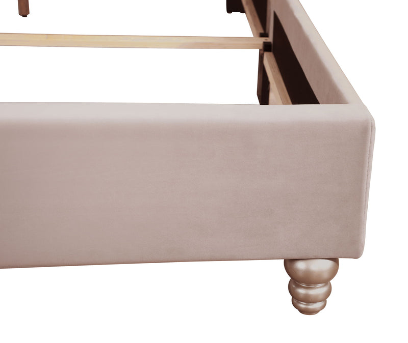 Transitional upholstered bed by Glory Furniture with plush fabric and modern design, shown in a well-lit bedroom setting.