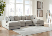 Benchcraft® Aslan Court 5-piece sectional living room set with matching ottoman, featuring plush fabric upholstery and modern design.