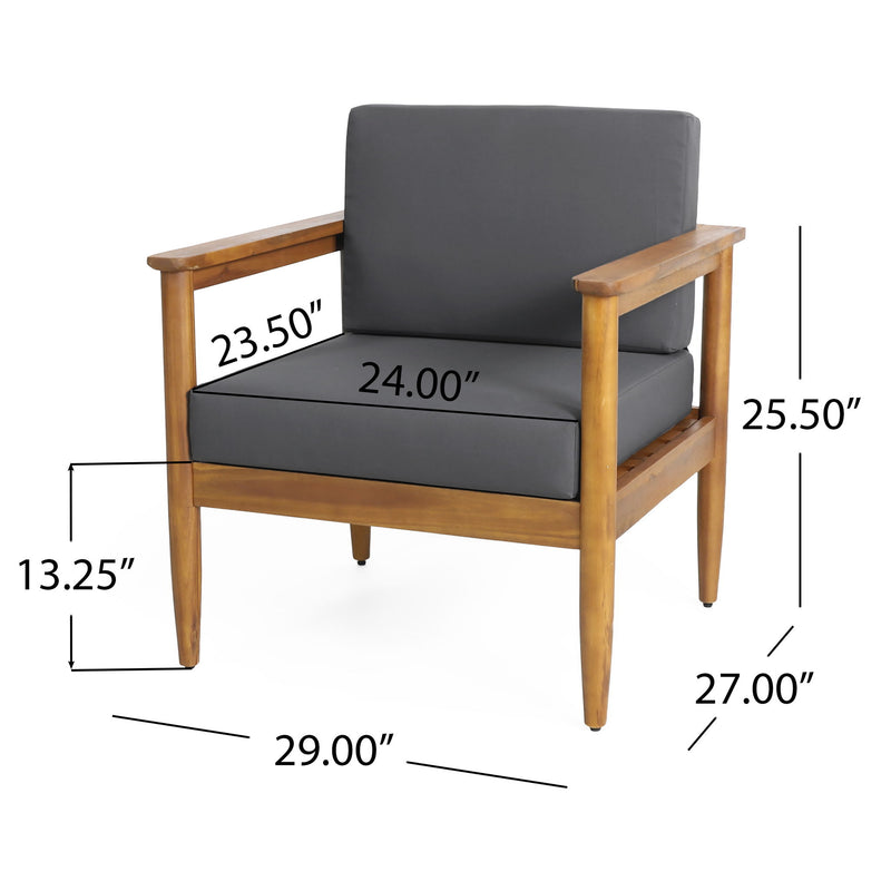 Dark gray outdoor club arm chair with teak acacia wood frame, stylish patio chair by Noble House in a cozy outdoor setting.
