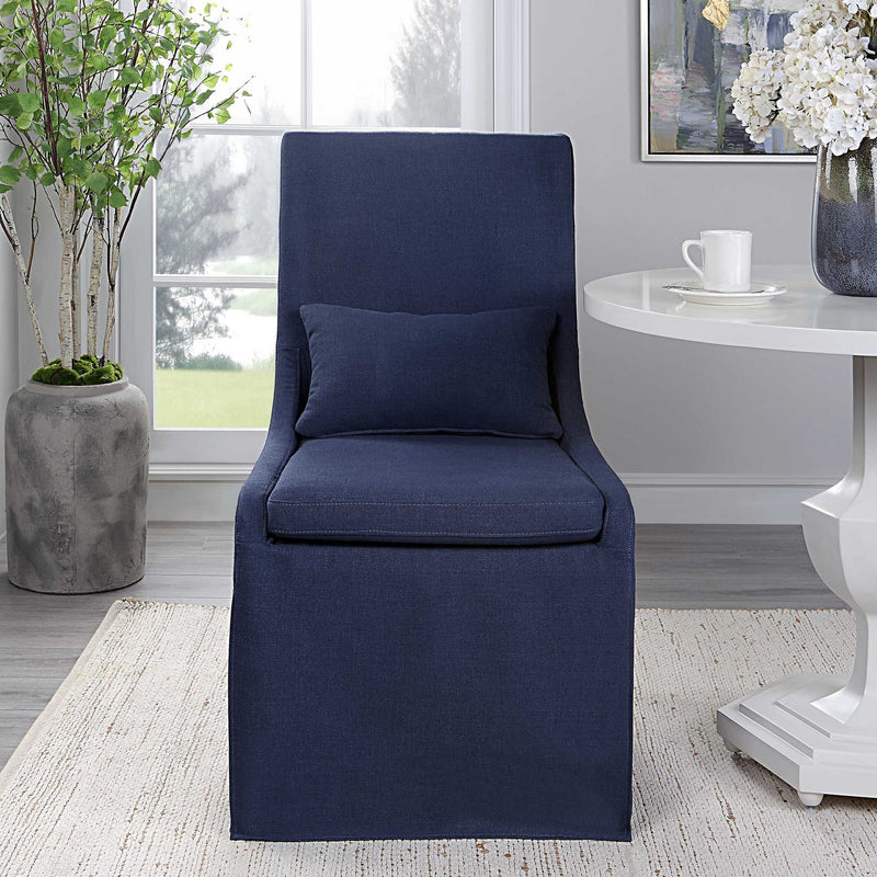 Uttermost Coley armless side chair with plush upholstery and wooden legs, modern design for living room or lounge area.