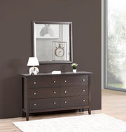 Glory Furniture Primo mirror with a sleek rectangular frame, hung on a wall, reflecting a modern interior space.