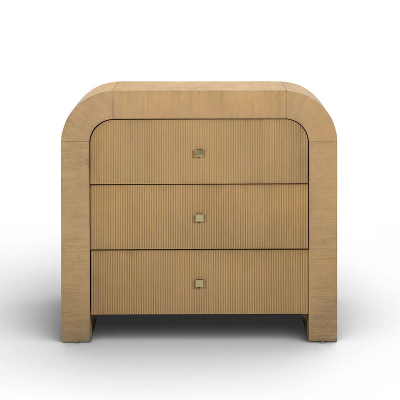 TOV Furniture Hump bedside chest with wood finish and modern design, featuring drawer handles and compact storage space.