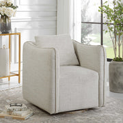Uttermost Corben silver swivel armchair with modern design, featuring a sleek, rounded shape and cushioned seat for comfortable seating.