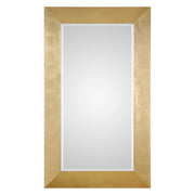 Uttermost Chaney gold wall mirror with a sleek, modern frame, mounted on a wall for stylish home decor.