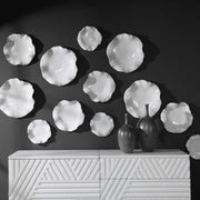 Set of three Abella ceramic wall decor pieces by Uttermost, featuring textured, artistic ceramic designs for modern interior accents.