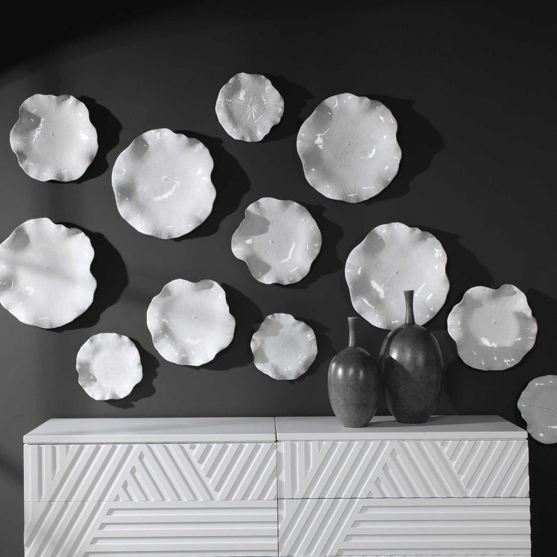 Set of three Abella ceramic wall decor pieces by Uttermost, featuring textured, artistic ceramic designs for modern interior accents.