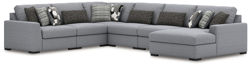 Benchcraft Bealton sectional sofa in a stationary design with plush cushions and neutral fabric upholstery.