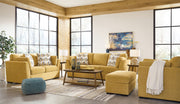 Signature Design by Ashley Keerwick living room set with stationary chair and matching ottoman in neutral fabric.