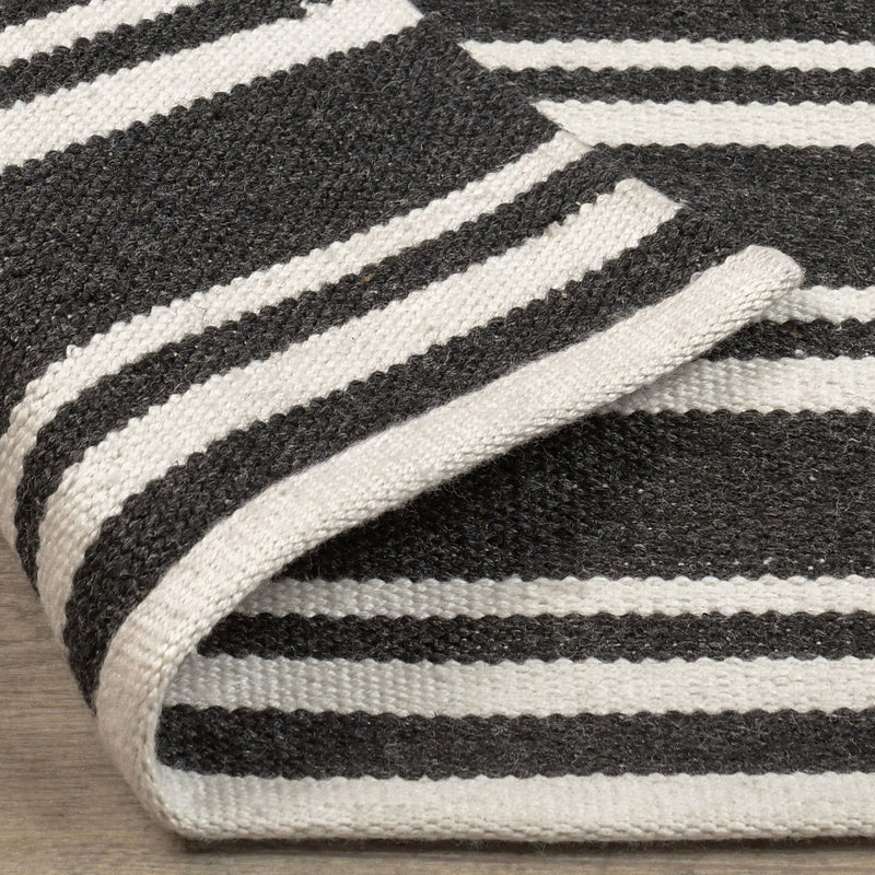 Classic Home Palma stripe area rug with bold geometric pattern in neutral tones, perfect for modern home decor.