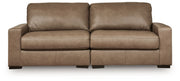 Benchcraft Veronella stationary sectional sofa with plush cushions and modern design in a cozy living room setting.