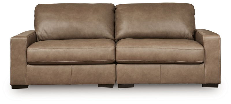 Benchcraft Veronella stationary sectional sofa with plush cushions and modern design in a cozy living room setting.