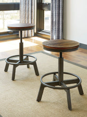 Torjin - 3 Pc. - Long Counter Table, 2 Stools - Dark Brown - R&R Furniture Gallery (Fountain Valley, CA)