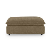 Classic Home Caplan upholstered ottoman with plush fabric and wooden legs, versatile piece for living room or lounge area.