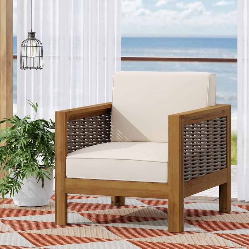 Outdoor acacia wood club arm chair with wicker accents by Noble House, featuring a sturdy frame and woven wicker details.