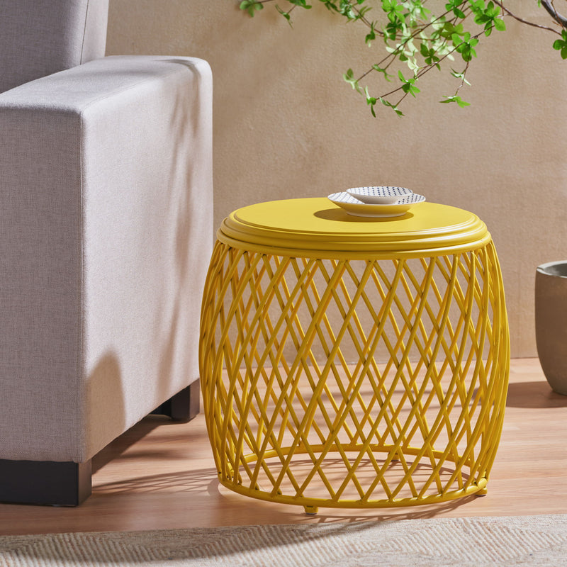 Noble House Alamera side table with wooden finish and modern design, featuring a round top and sleek black metal legs.