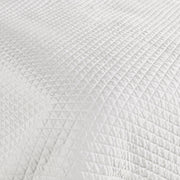 Classic Home diamond quilt with matching shams, featuring a textured pattern and soft fabric for a cozy bedroom look.