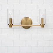 Regal - Double Light Vanity With Clear Ribbed Satin - Antique Brass / Clear - R&R Furniture Gallery (Fountain Valley, CA)