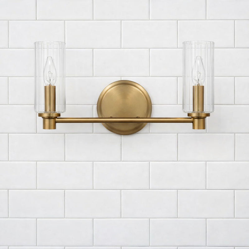 Regal - Double Light Vanity With Clear Ribbed Satin - Antique Brass / Clear - R&R Furniture Gallery (Fountain Valley, CA)