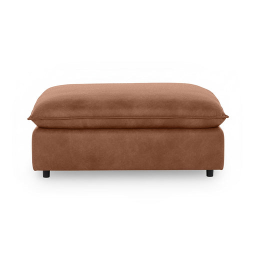 Classic Home Caplan upholstered ottoman with a plush fabric finish, serving as a versatile footrest or accent piece.