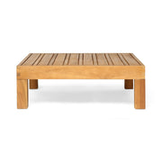 Noble House Mythical square outdoor coffee table with teak frame and slat top, ideal for patio or garden seating areas.