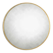 Uttermost Junius round wall mirror with sleek metal frame, hanging on a modern wall, showcasing its contemporary design.