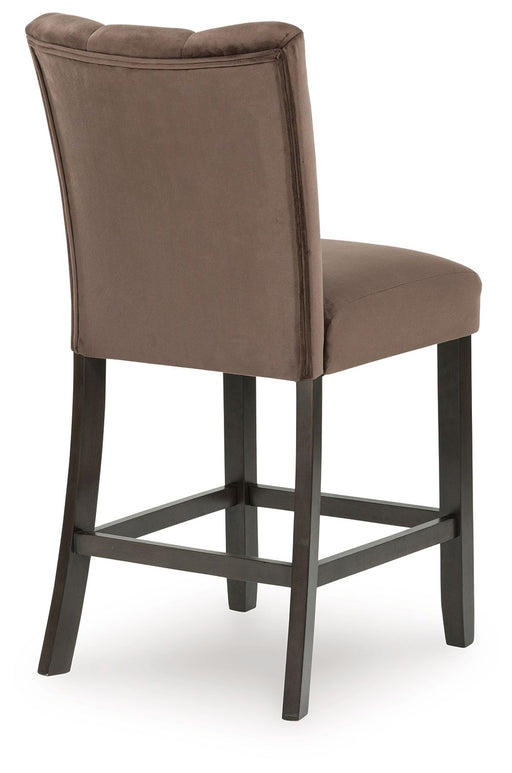 Pair of Jeshina Mocha upholstered barstools by Signature Design by Ashley®, featuring padded seats and sleek wooden legs.