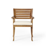 Outdoor Noble House Hermosa 5-piece teak wood dining set with beige cushions, includes table and four chairs for patio dining.