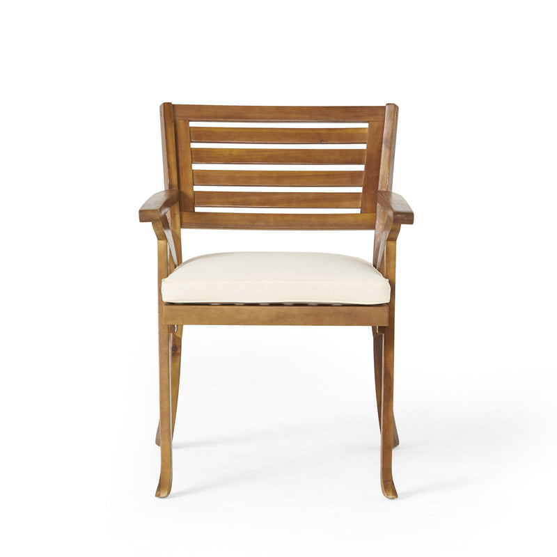 Outdoor Noble House Hermosa 5-piece teak wood dining set with beige cushions, includes table and four chairs for patio dining.