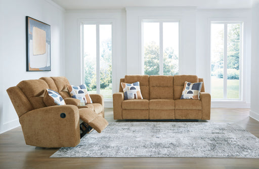 Signature Design by Ashley Kanlow reclining living room sofa set with plush cushions and reclining features, ideal for comfortable seating.