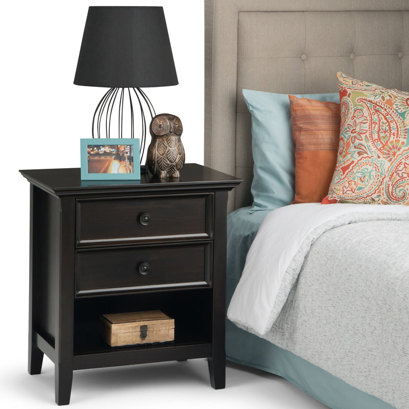 Handcrafted Amherst bedside table by Simpli-Home, featuring a wooden surface and storage drawer for bedroom organization.