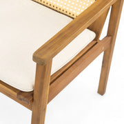 Noble House Preston outdoor dining chair set with teak frames and beige cushions, two chairs shown side by side.