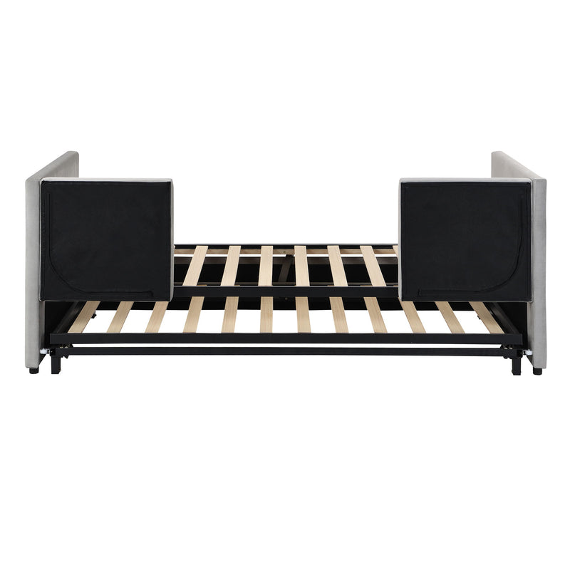Twin size upholstered daybed with pop-up trundle from Halcyon Home, featuring plush fabric and modern design, with the trundle pulled out.