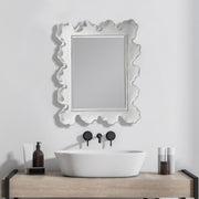 Uttermost Sea Coral wall mirror featuring a detailed coral-inspired design with a round shape and decorative frame.