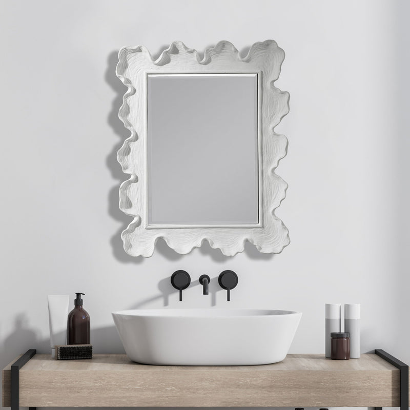 Uttermost Sea Coral wall mirror featuring a detailed coral-inspired design with a round shape and decorative frame.