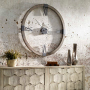 Uttermost Marcelo modern wall clock with light brown wooden frame and minimalist design for contemporary home decor.